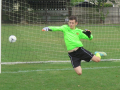 The U15s Goal keeper in flight.