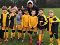 Peteborough Striker Lee Angol supports the Under 9s