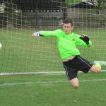 The U15s Goal keeper in flight.